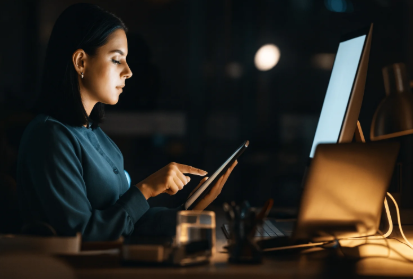 Business owner managing Tellacity reputation on her laptop